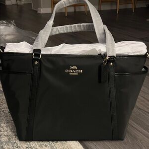 Coach Black and Gold Tote baby bag Brand new, never been open.